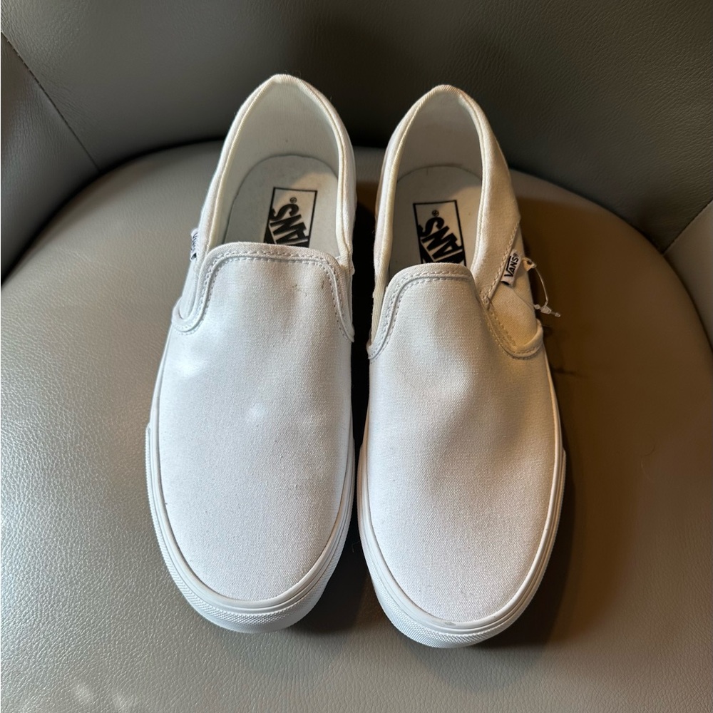 Vans women’’s classic slip ons pure white, size 9.5.